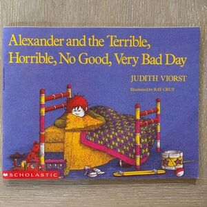 Scholastic Yellow Cover Book with Black Illustration